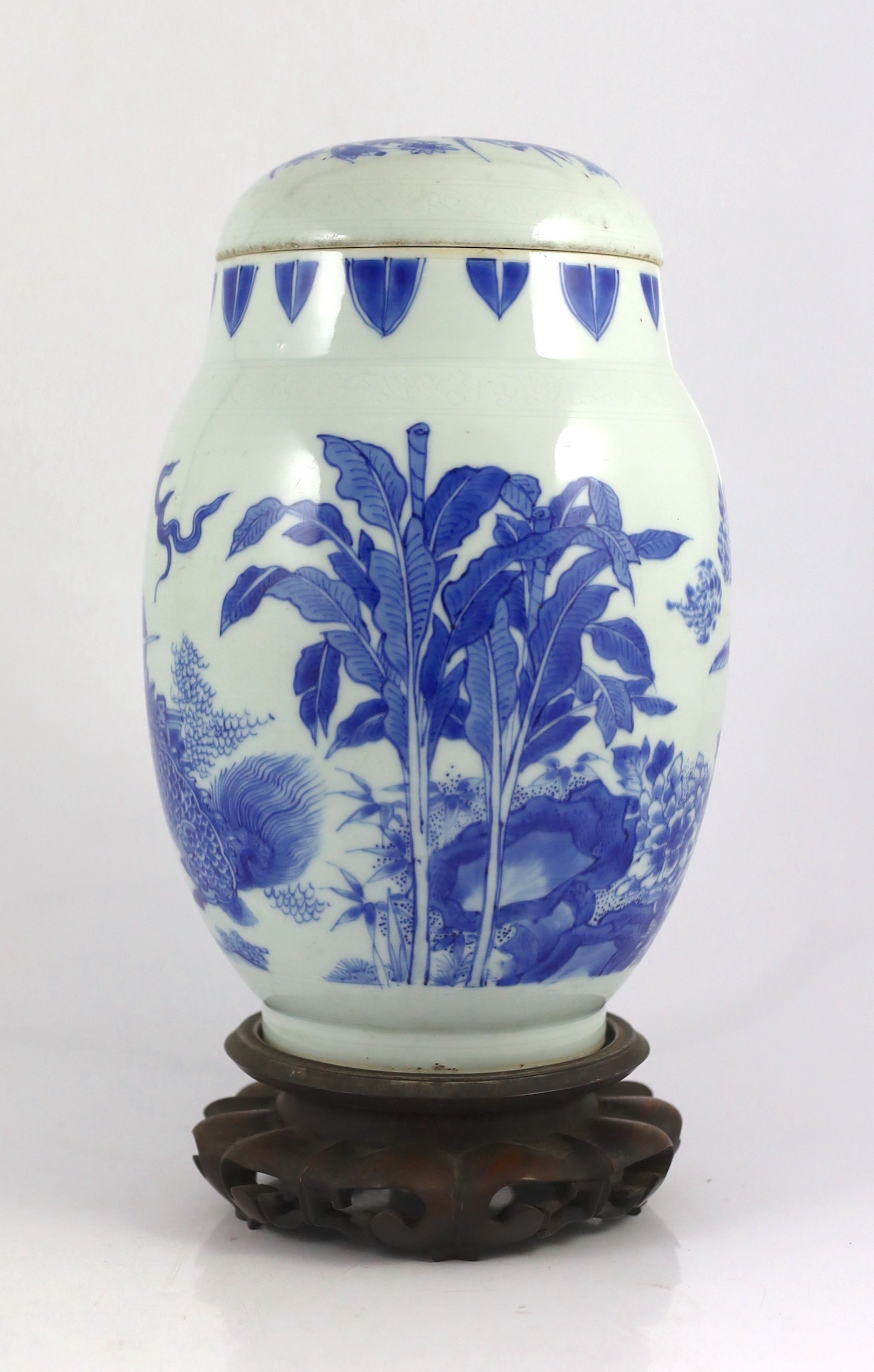 A good Chinese Transitional blue and white ‘qilin and phoenix’ jar and cover, lianzi guan, Chongzhen period (1627-1644), chips to inner flange of cover